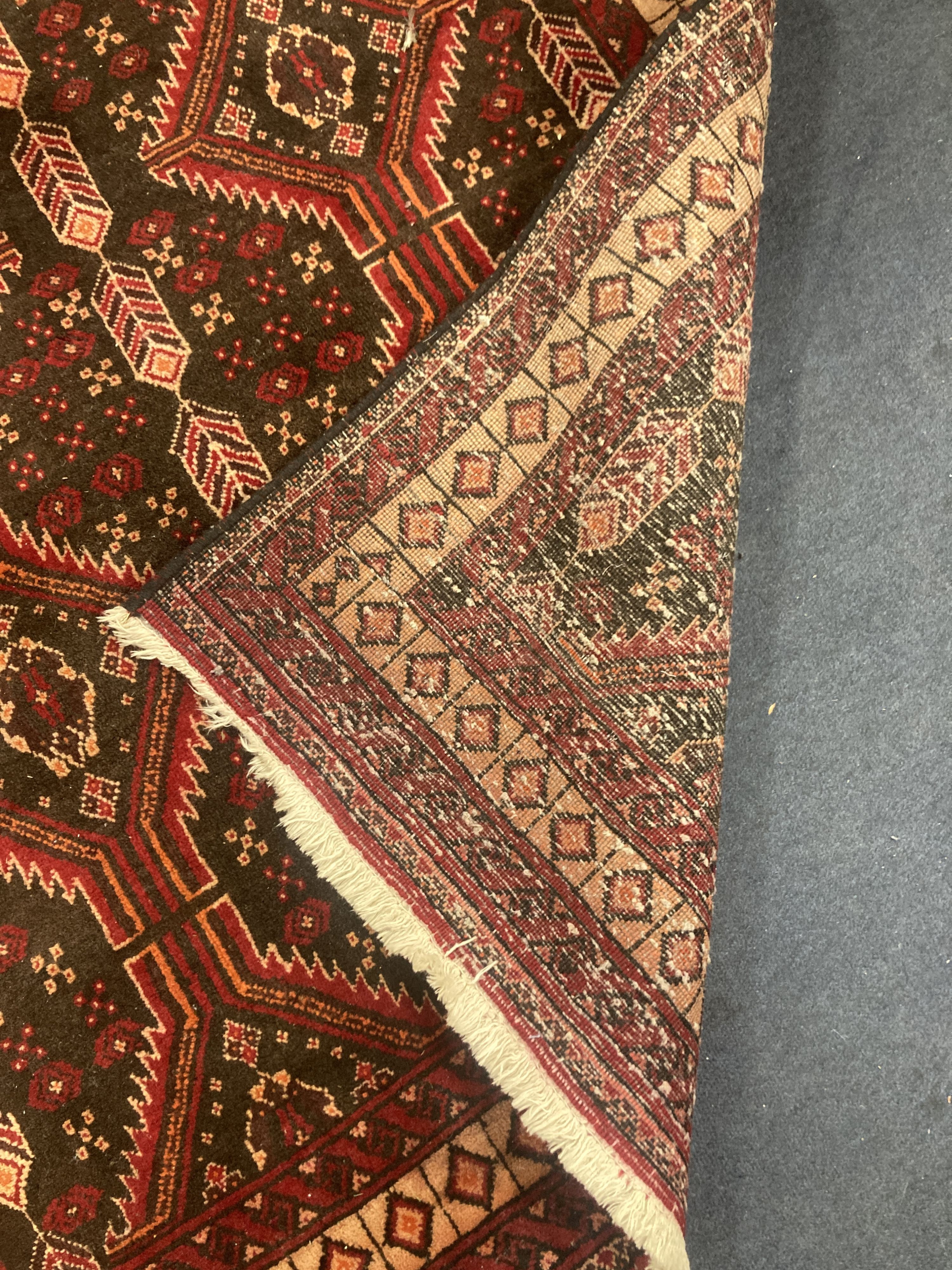 A Bakhtiari red ground rug, 210 x 110cm 210 x 110cm